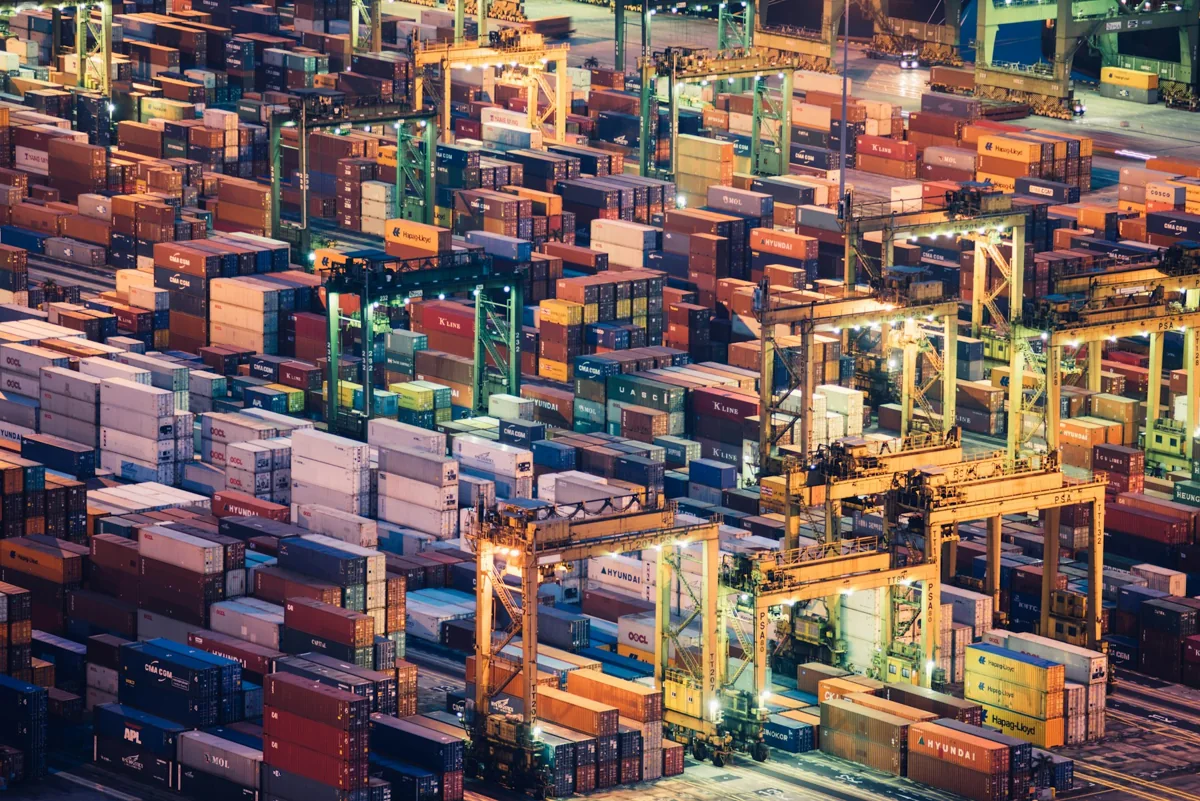 Shipping containers arranged across a commercial freight port.